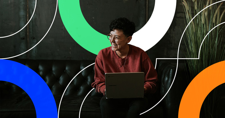 a man sitting in a chair with a laptop