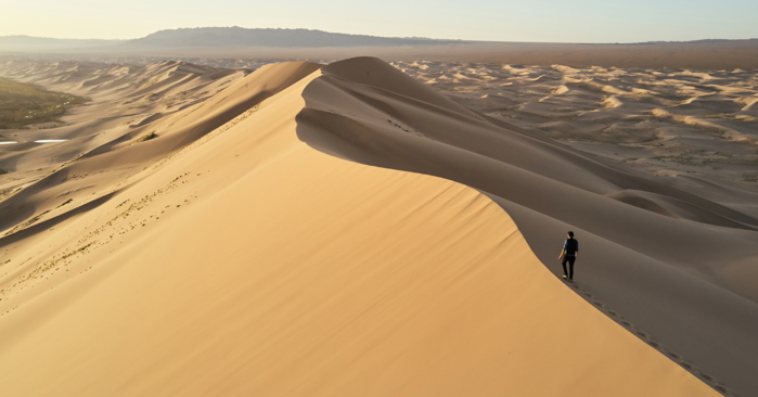 a person walking in the desert