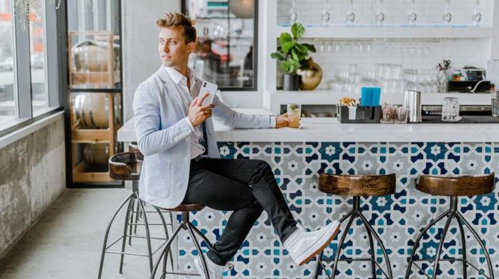 a person sitting on a stool