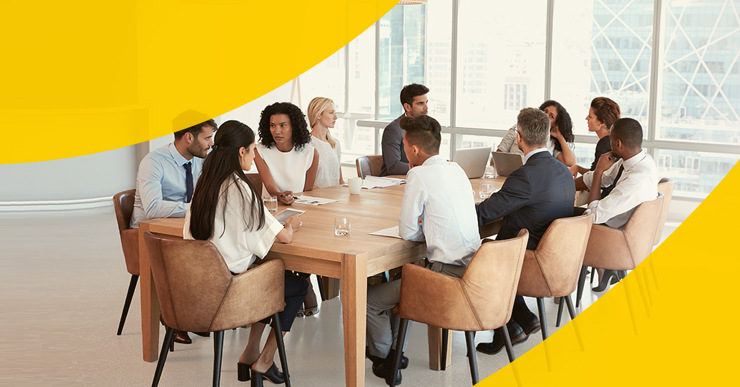 a group of people sitting around a table