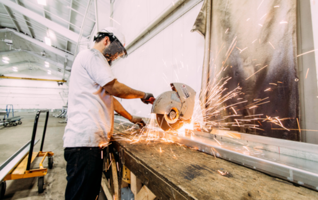 a man working on a piece of wood