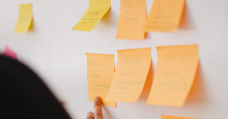 a person holding a bunch of sticky notes