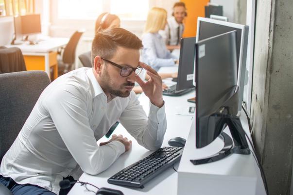 a man sitting at a computer